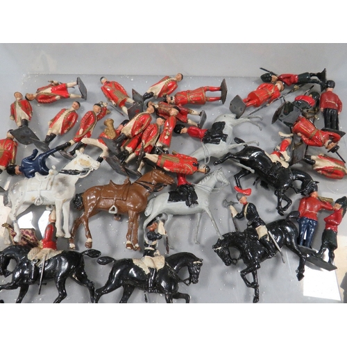 511 - A box of Britains soldiers and horses