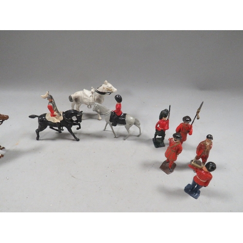 511 - A box of Britains soldiers and horses