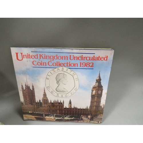 537 - A box of collectables to include vintage British coinage, dog tags etc