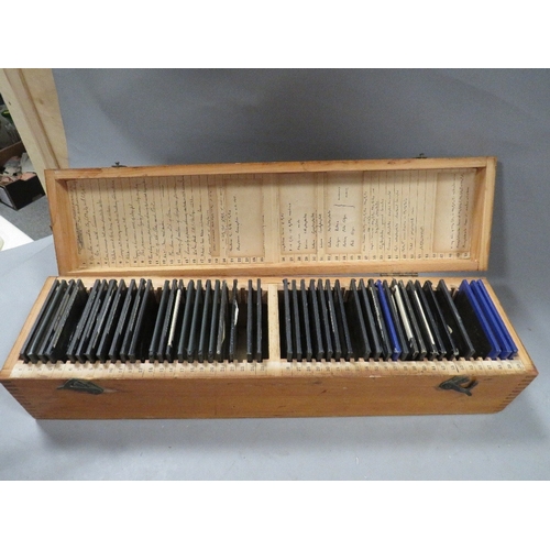 551 - A wooden case of vintage magic lantern slides manly industrial scenes