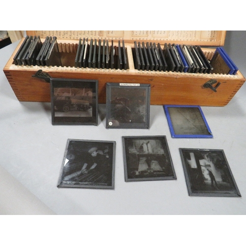 551 - A wooden case of vintage magic lantern slides manly industrial scenes