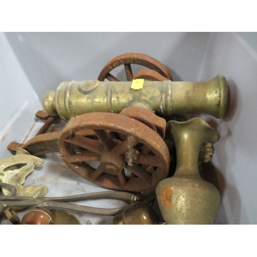 128 - A tray of assorted metal ware to include a cannon, sail ship door stop, fire dogs etc