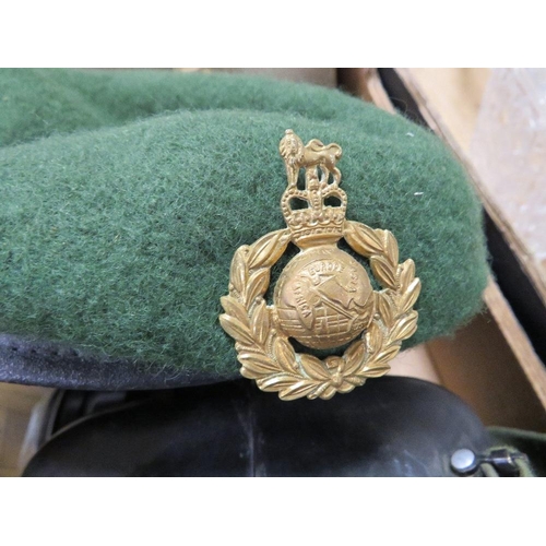 63 - A small tray of militaria to include a child's gas mask