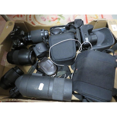 69 - A box of collectable cameras and lenses