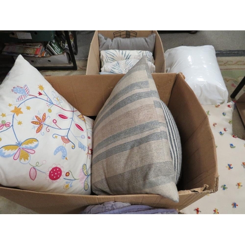 112 - Three boxes of decorative cushions and throws etc