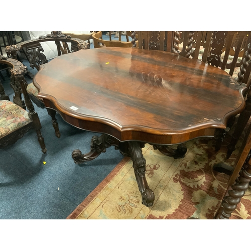 805 - An antique rosewood shaped centre table S/D