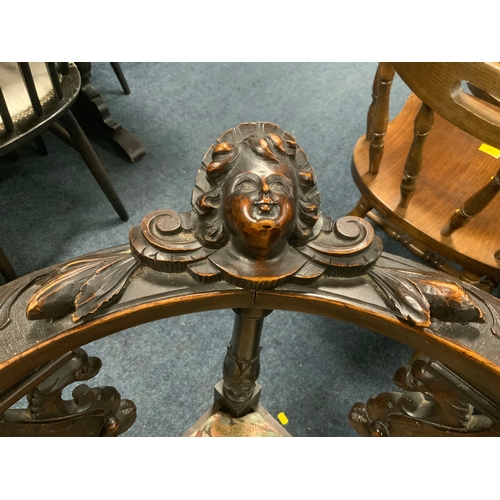 806 - A pair of antique carved oak corner armchairs with mask head detail