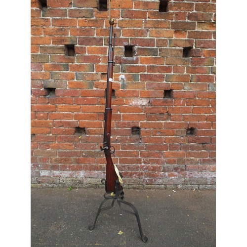 115 - A vintage flintlock rifle converted to a standard lamp with bent wrought iron base