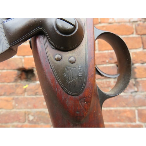 115 - A vintage flintlock rifle converted to a standard lamp with bent wrought iron base