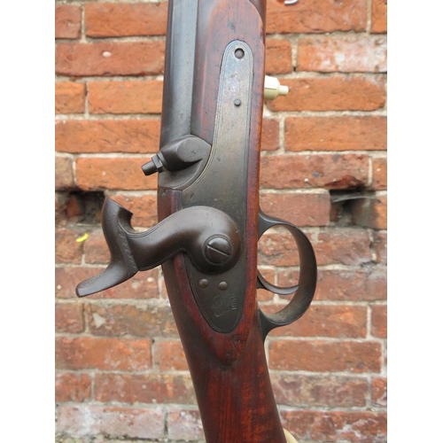 115 - A vintage flintlock rifle converted to a standard lamp with bent wrought iron base