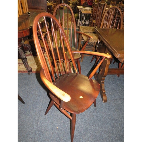 771 - An Ercol dining set comprising an extending table and four chairs