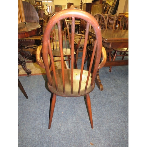 771 - An Ercol dining set comprising an extending table and four chairs