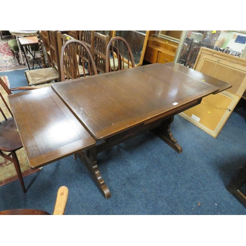 771 - An Ercol dining set comprising an extending table and four chairs