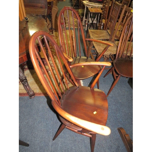 771 - An Ercol dining set comprising an extending table and four chairs