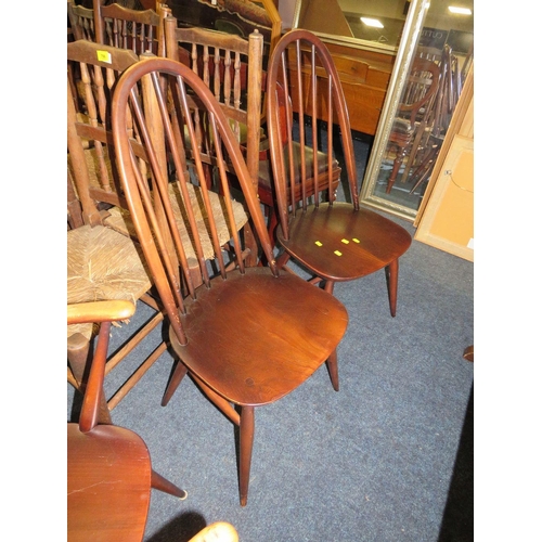 771 - An Ercol dining set comprising an extending table and four chairs