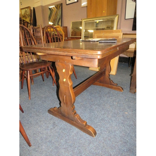 771 - An Ercol dining set comprising an extending table and four chairs