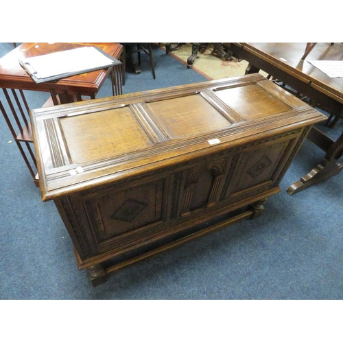 772 - A carved oak coffer - W 106 cm