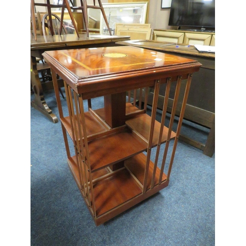 773 - An reproduction inlaid revolving bookcase