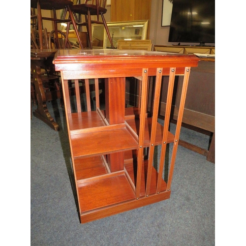 773 - An reproduction inlaid revolving bookcase