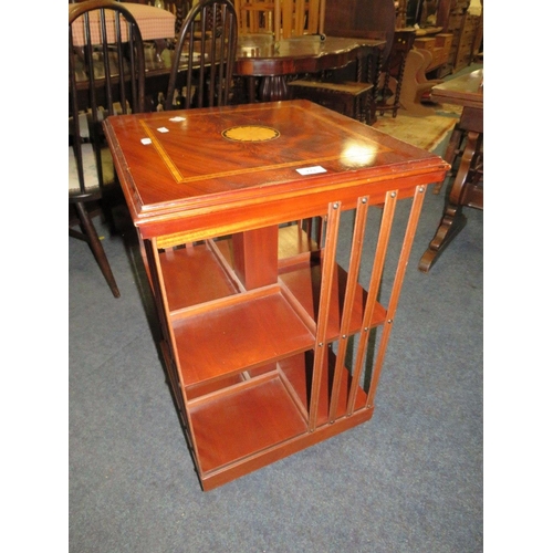 773 - An reproduction inlaid revolving bookcase