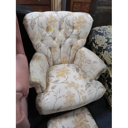 781 - A floral button backed armchair with matching footstool