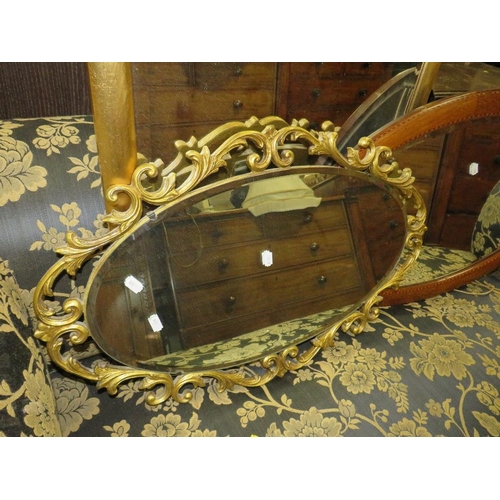 783 - Three wall mirrors to include a modern rectangular framed example and an oval mahogany frame example... 