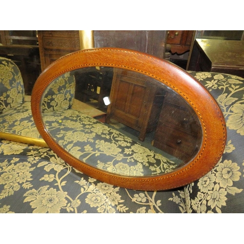 783 - Three wall mirrors to include a modern rectangular framed example and an oval mahogany frame example... 