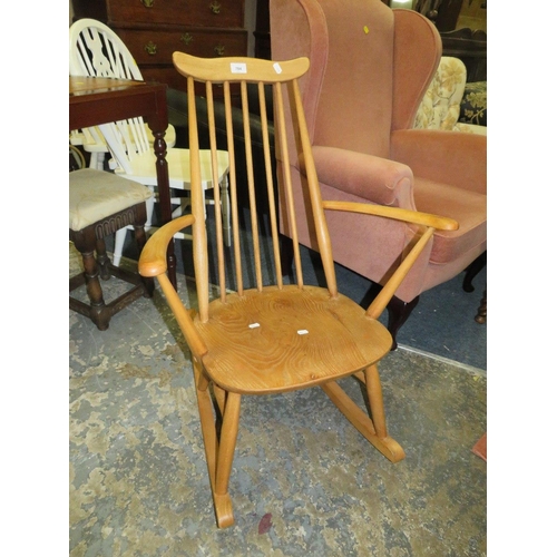 784 - An Ercol blonde oak rocking chair