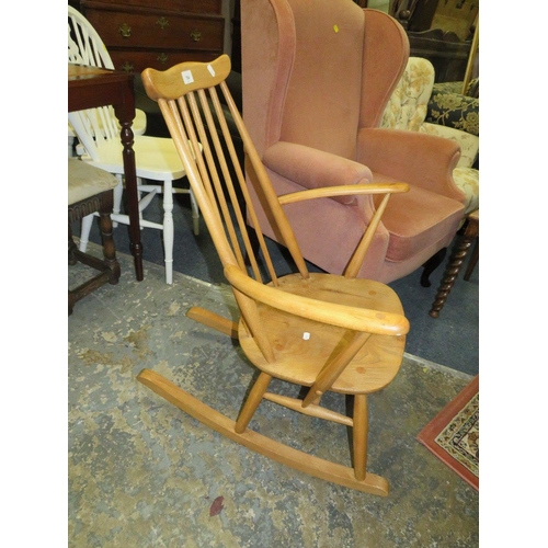 784 - An Ercol blonde oak rocking chair