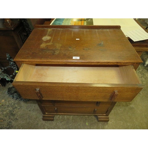 786 - An Art Deco oak cased four drawer chest - W 74 cm, A/F