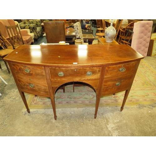 787 - An antique mahogany bow fronted sideboard - W148 cm