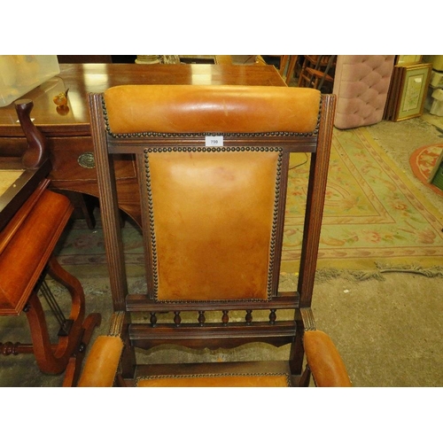 790 - An Edwardian mahogany rocking chair with padded leather panels