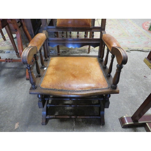 790 - An Edwardian mahogany rocking chair with padded leather panels