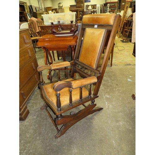 790 - An Edwardian mahogany rocking chair with padded leather panels