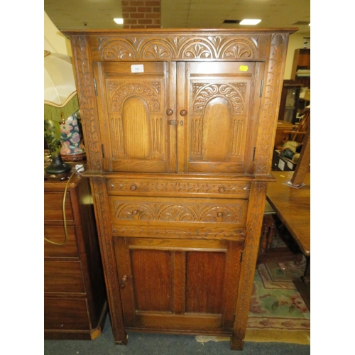 793 - An oak carved drinks cabinet - W 70 cm