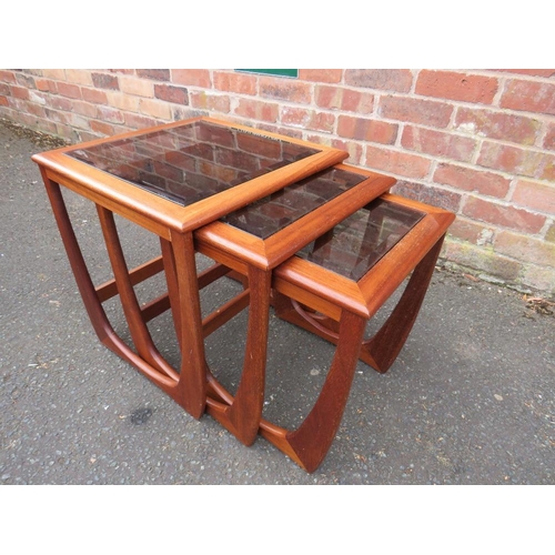 803 - A retro teak nest of three glass topped tables in G-Plan Astro style design