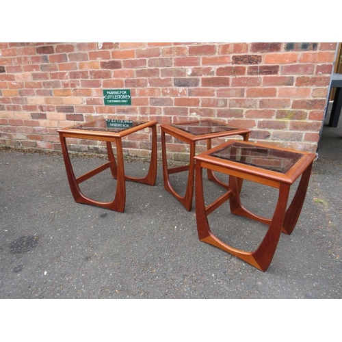 803 - A retro teak nest of three glass topped tables in G-Plan Astro style design