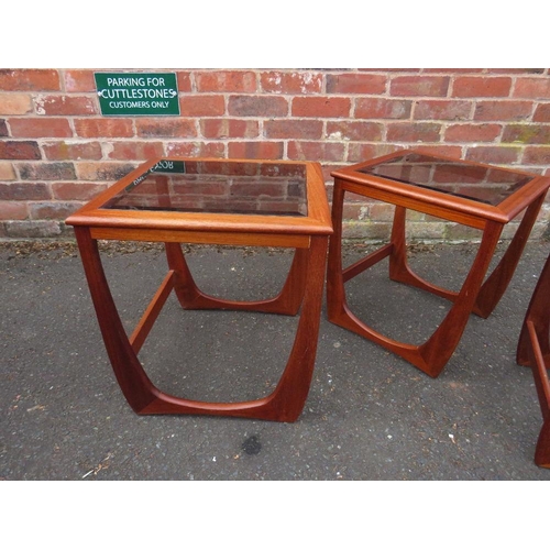 803 - A retro teak nest of three glass topped tables in G-Plan Astro style design