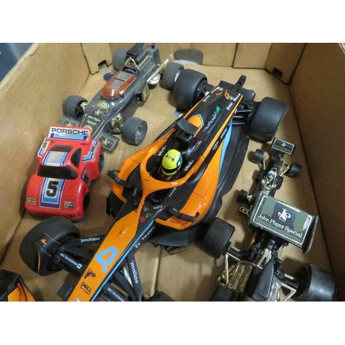 85 - A tray of remote control cars, Formula 1 cars and a boxed Cybon 1 Bionic Cybernetic driver set