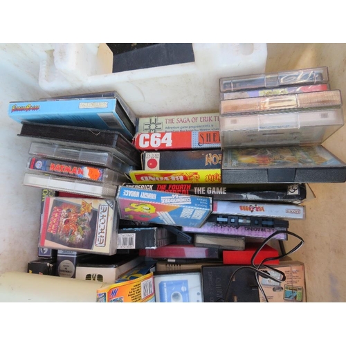 87 - A Commodore  64 computer system together with a large selection of computer games, manuals, joystick... 