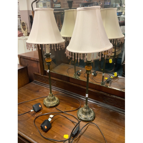 814 - A pair of slender table lamps with shades