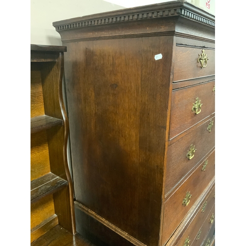 824 - An antique oak tall boy with two short over three long drawers and three further long drawers to the... 