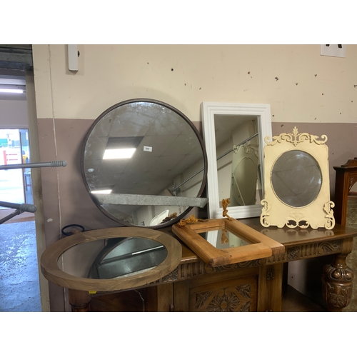 826 - Six assorted modern mirrors to include a metal circular example together with a metal hat stand