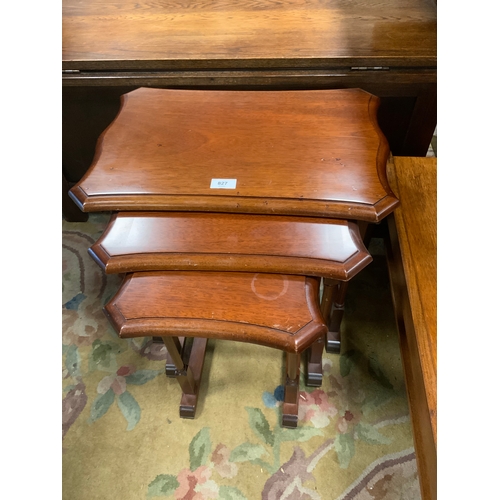 827 - A reproduction nest of mahogany tables