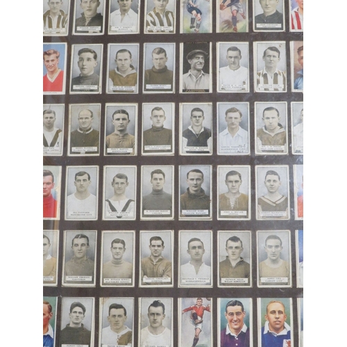 14 - Seven assorted framed cigarette cards to include golfers