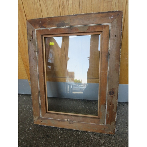 32 - A 19TH CENTURY GOLD FRAME, with gold slip and outer leaf design, glazed, with some restoration, fram... 