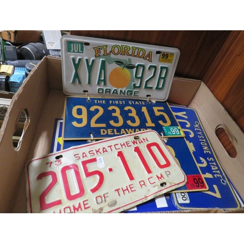 77 - A tray of vintage American license plates to include Florida and Delaware