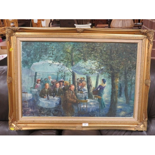 17 - A gilt framed oil painting depicting a Parisian cafe / street scene