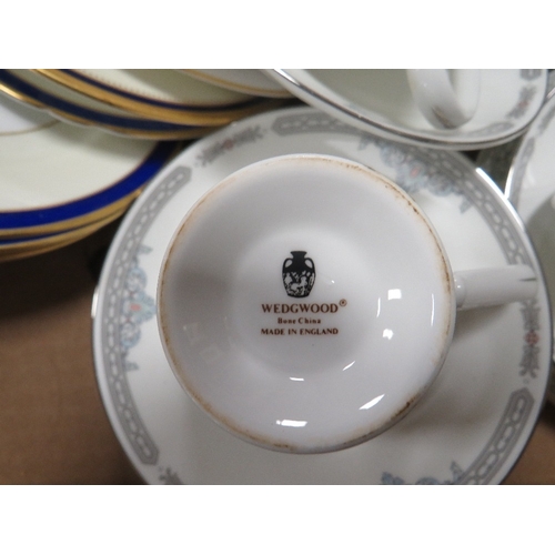 56 - A tray of assorted tea ware to include Wedgwood and Shelley