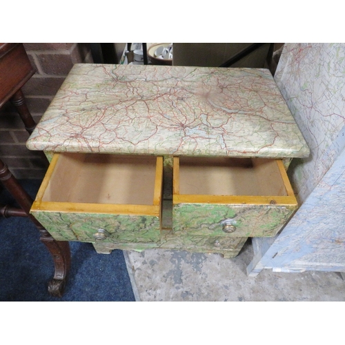 747 - A small chest of drawers and cabinet covered in map paper